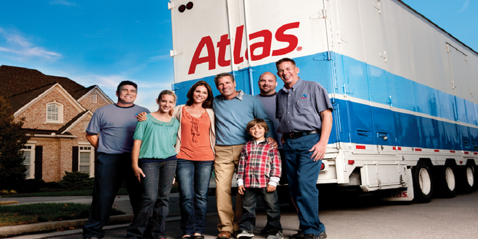 Family standing in front of Atlas Truck